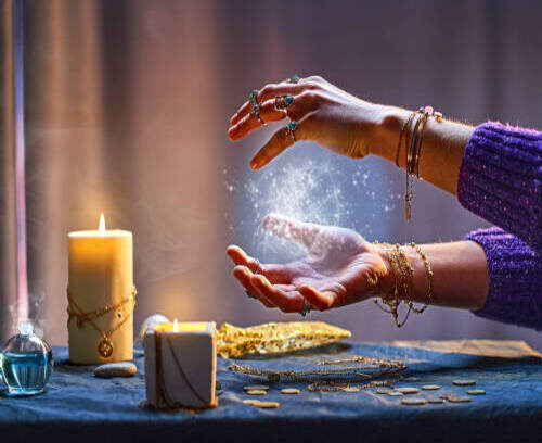 Magical luminous swirling glowing ball in the palm of a witch wizard woman during a witchcraft and occult esoteric spiritual ritual. Magic and sorcery